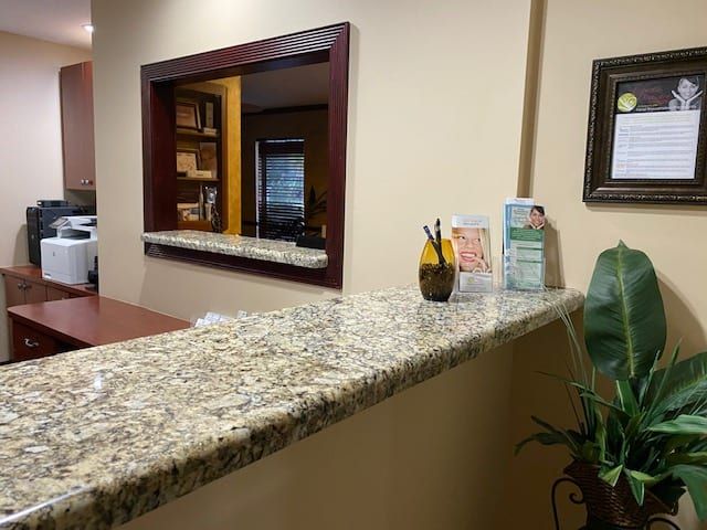 aesthetic dentistry of palm city front desk