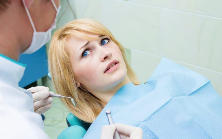 Woman looking afraid of dentist