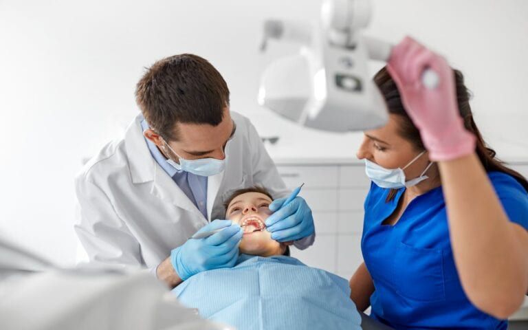 Dentist performing minimally invasive care
