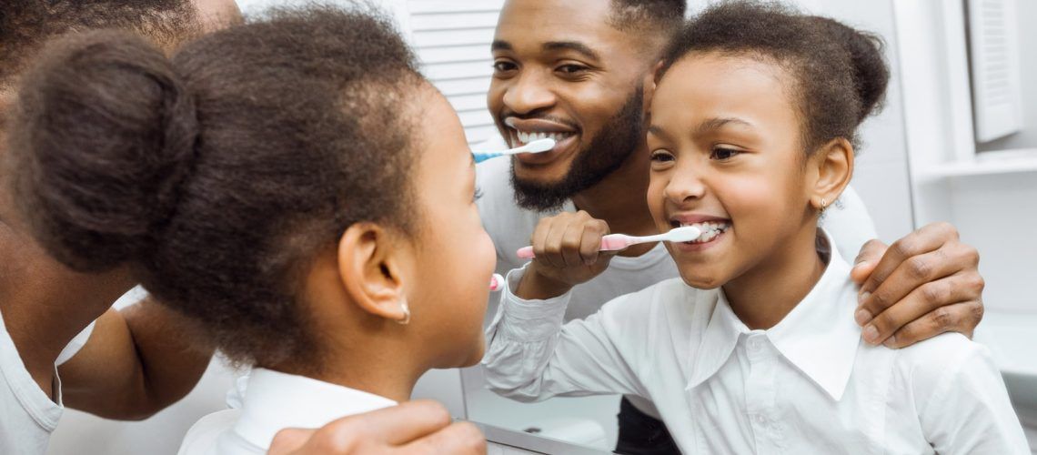 Family performing dental hygiene