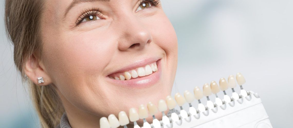 Woman Recieving Perfect Tooth Shade From Dentist